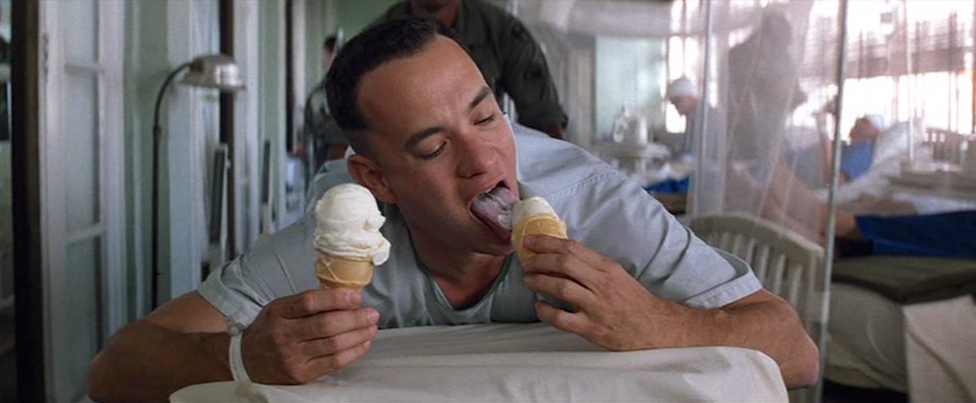 A man in the hospital eats two ice cream cones in this photo from Paramount Pictures.