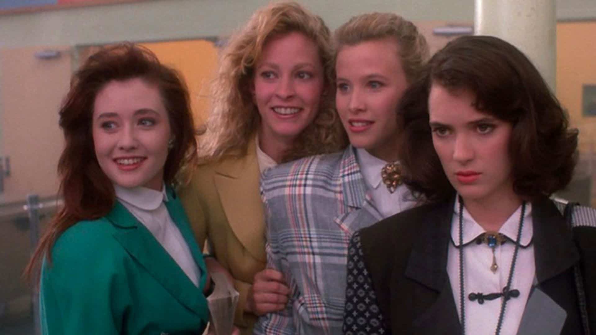 The Heathers and Veronica Sawyer group together in the high school in this image from Amazon Prime Video.