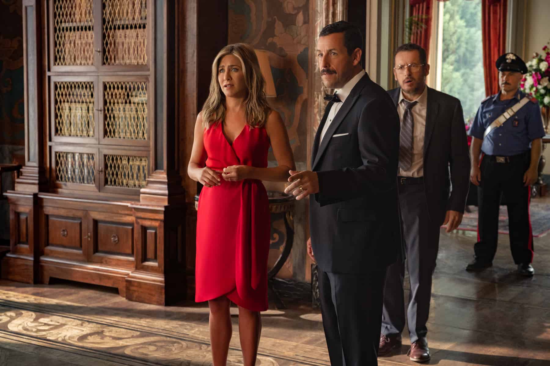 Jennifer Aniston, Adam Sandler, and Dany Boon in this image from Netflix
