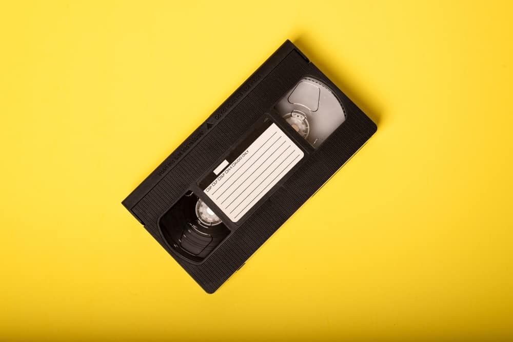 A black videotape on a yellow background in this image from Shutterstock