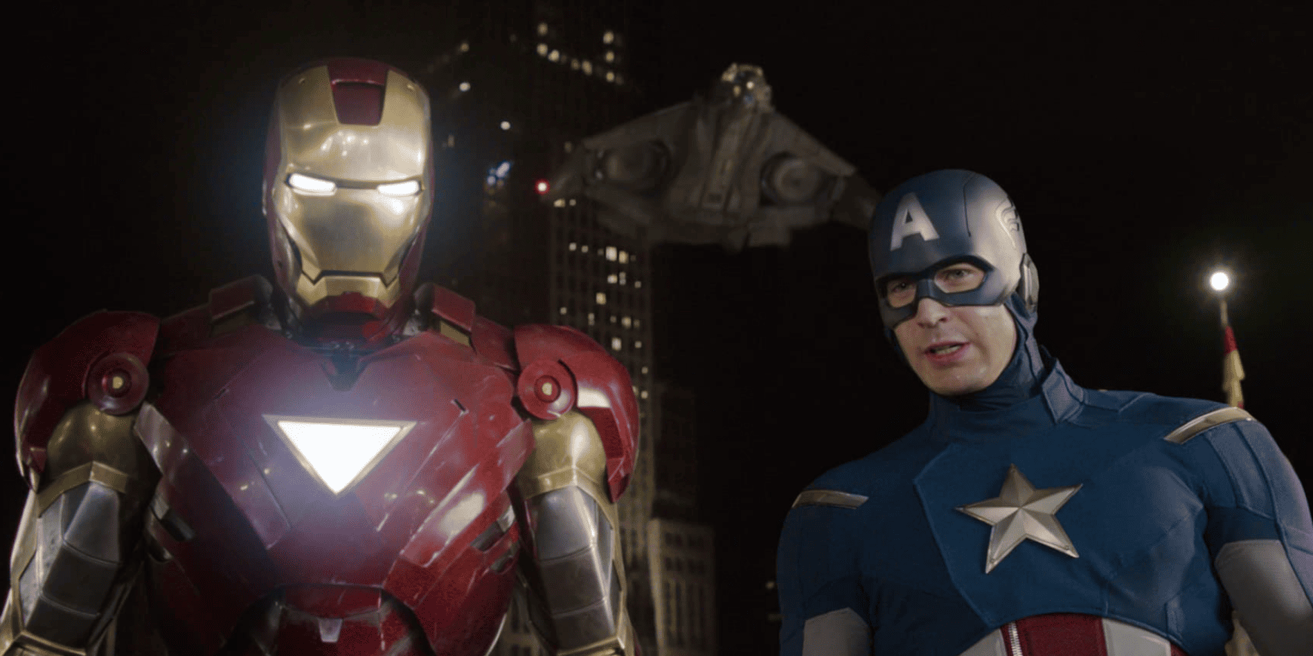 Iron Man and Captain America stand side by side with the jet behind them in this image from Marvel Studios