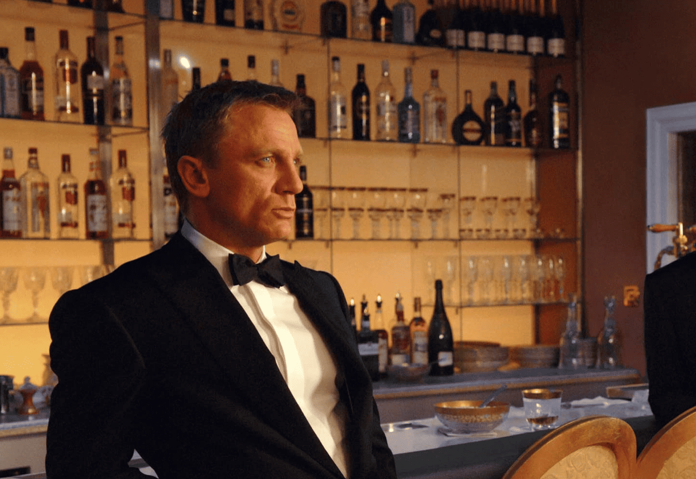 Bond takes stock of the casino room in this image from HBO Max