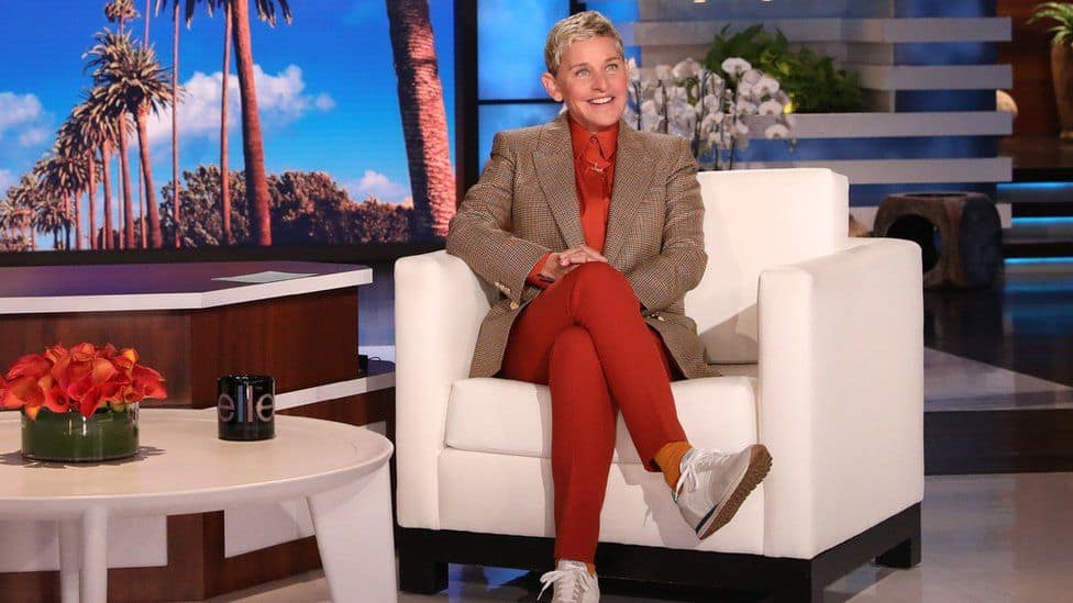 Ellen DeGeneres sitting in her armchair at the studio in this image from A Very Good Production