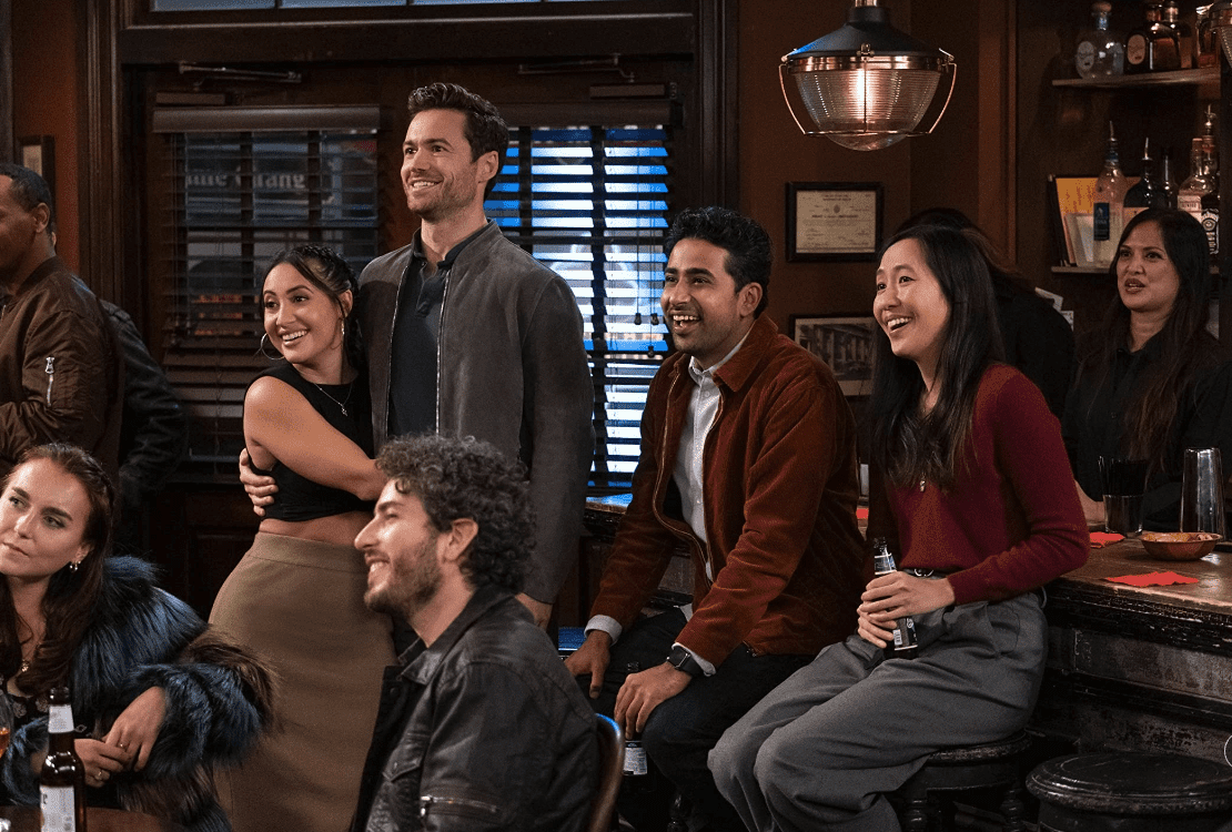 A group of friends in a bar in this image from Hulu