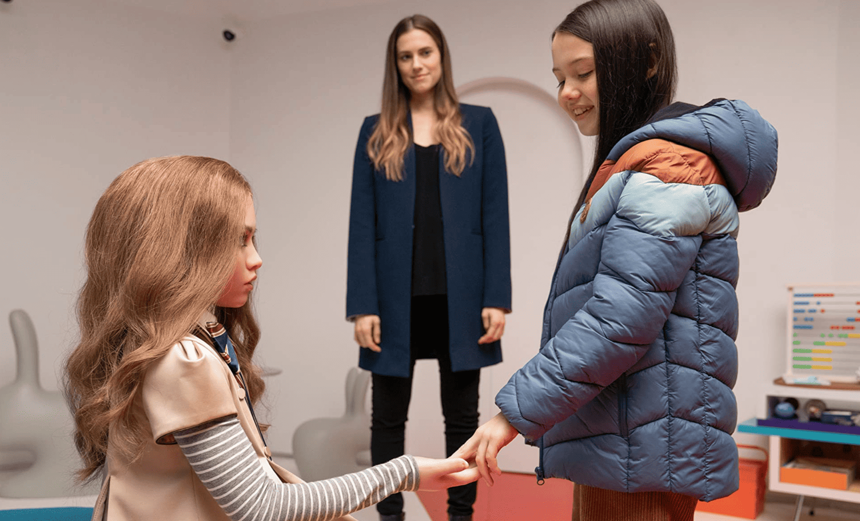 A girl meets her lifelike robot for the first time in this image from Peacock