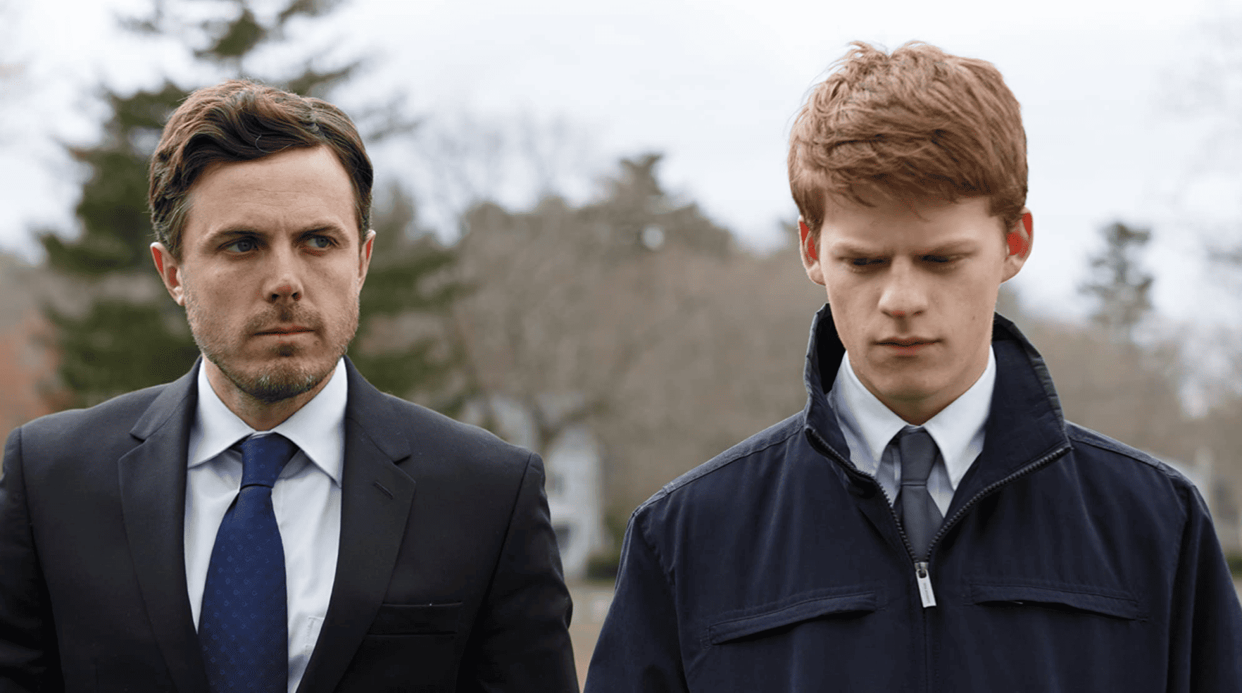 A man and teenager stand in suits outside in this image from Amazon Studios