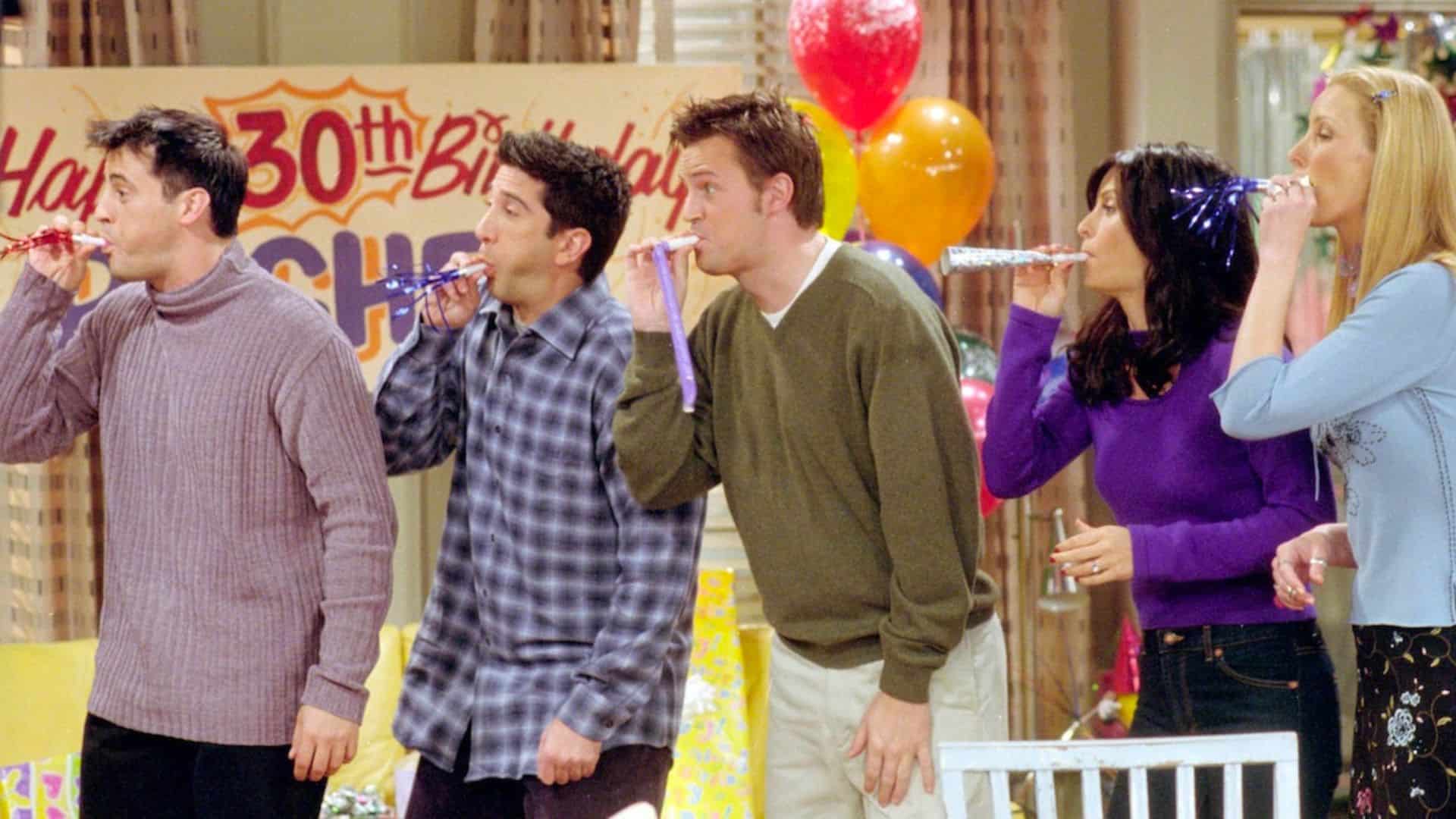 Joey, Ross, Chandler, Monica, and Phoebe wish Rachel a happy birthday in this image from Bright/Kauffman/Crane Productions