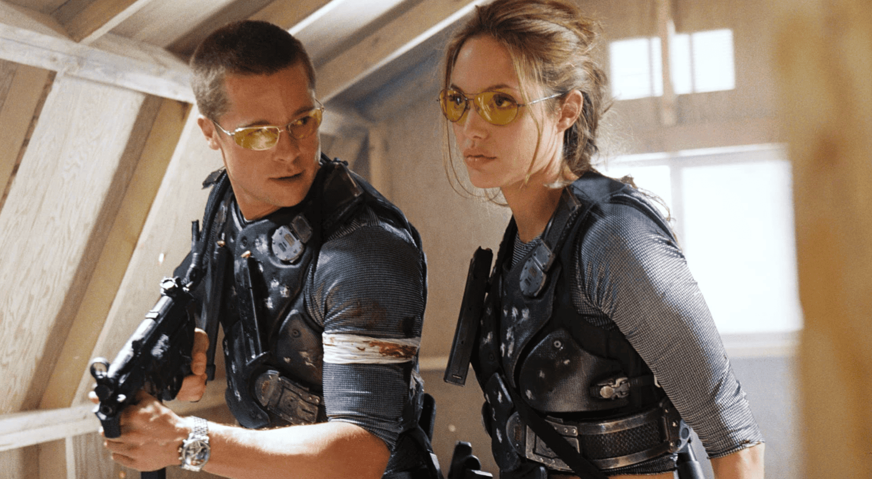 Brad Pitt and Angelina Jolie dressed in their assassin gear in this image from 20th Century Studios