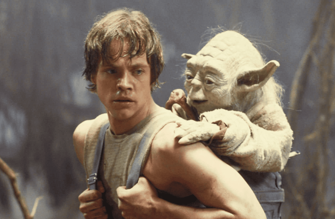 Mark Hamill as Luke Skywalker with Yoda in this image from Lucasfilm 