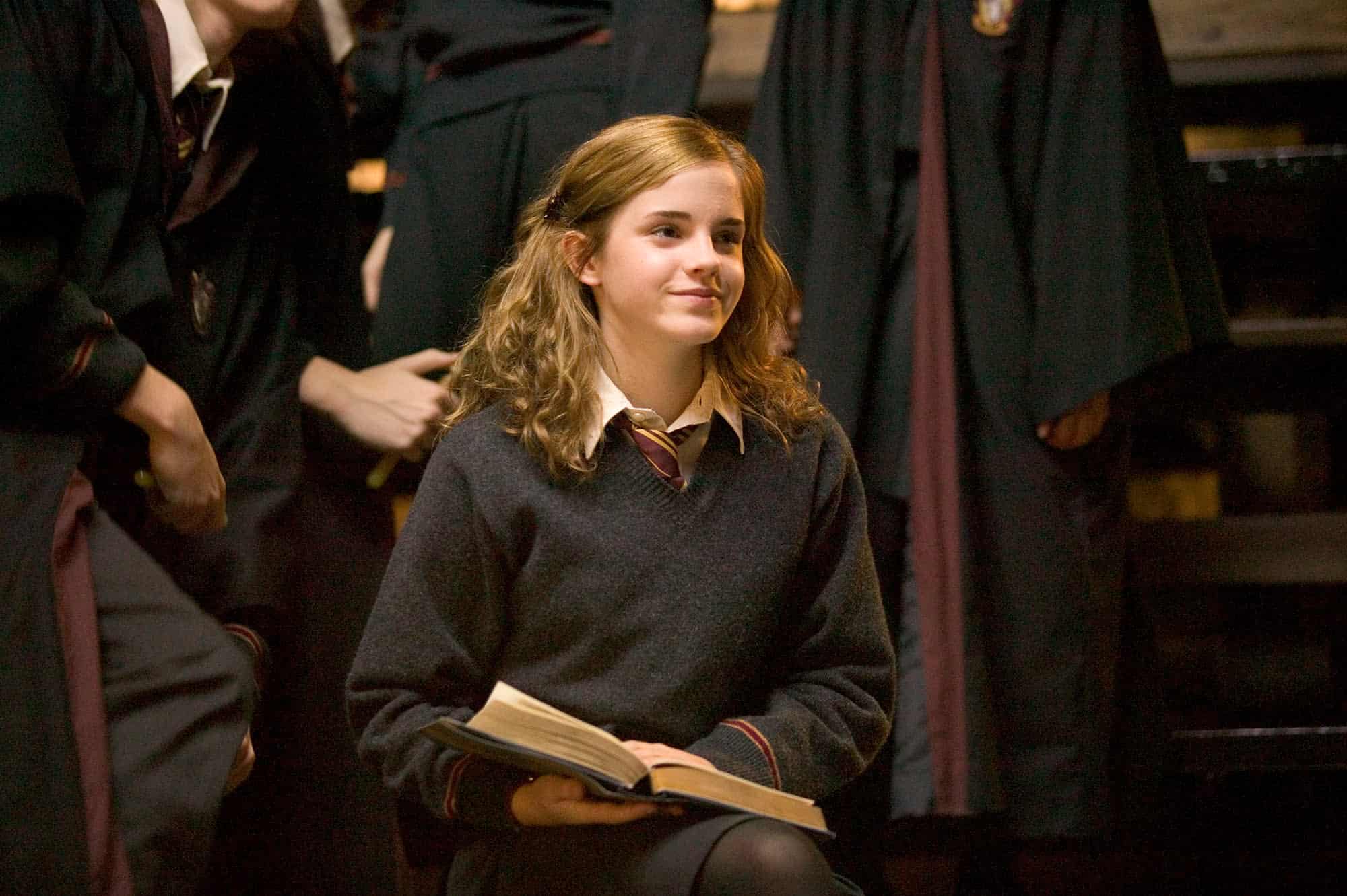 A schoolgirl sits with a book in this image from HBO Max