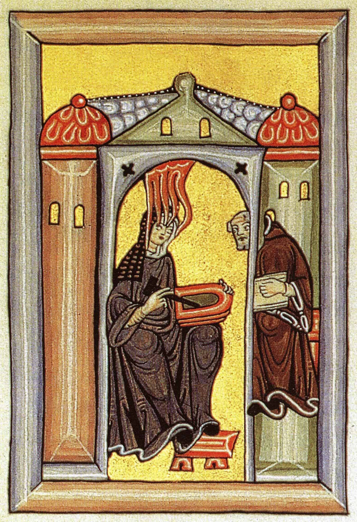 A medieval nun dictates her visions to a monk in this image from the Rupertsberg Codex of Liber Scivias provided by Wikimedia