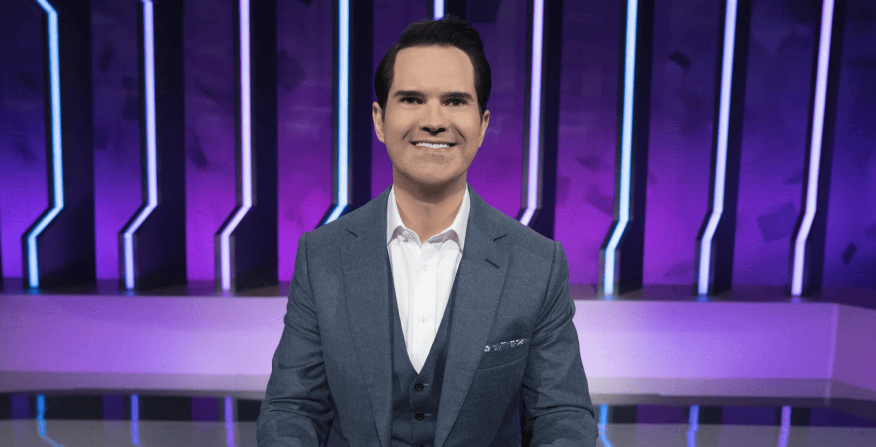Jimmy Carr is staring directly at the camera in this image from Netflix