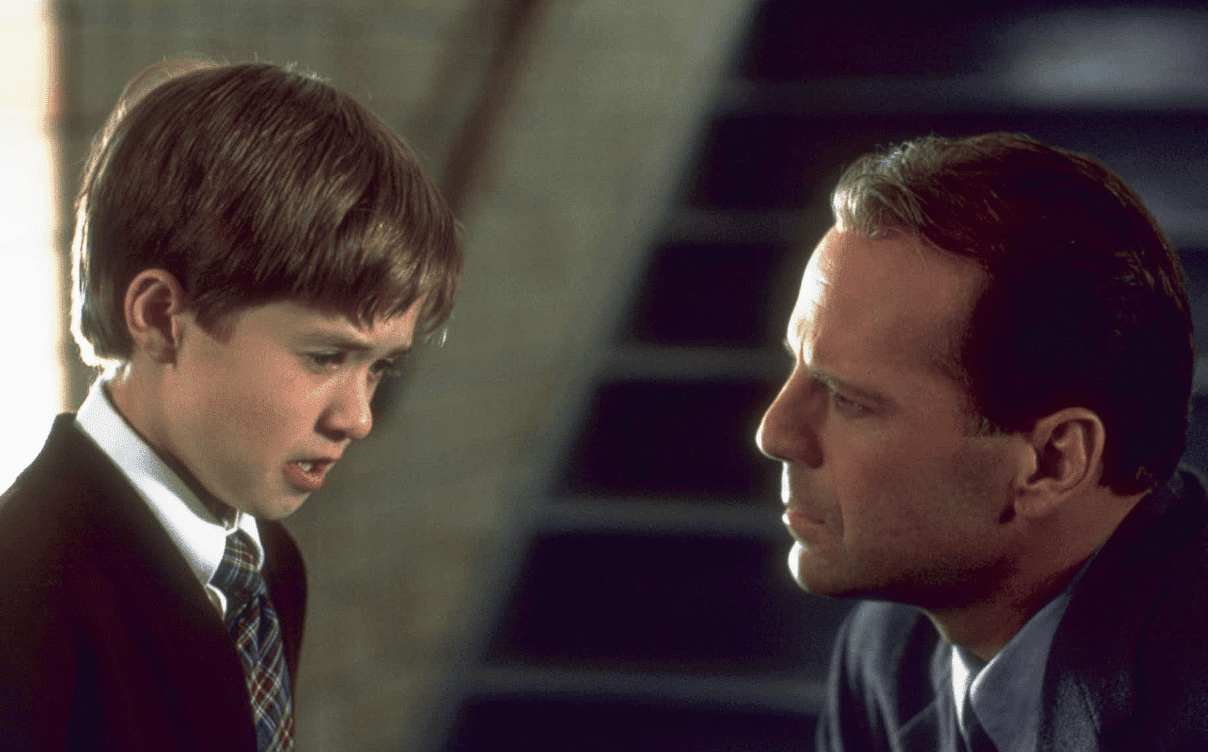 Haley Joel Osment and Bruce Willis in this image from Sling TV
