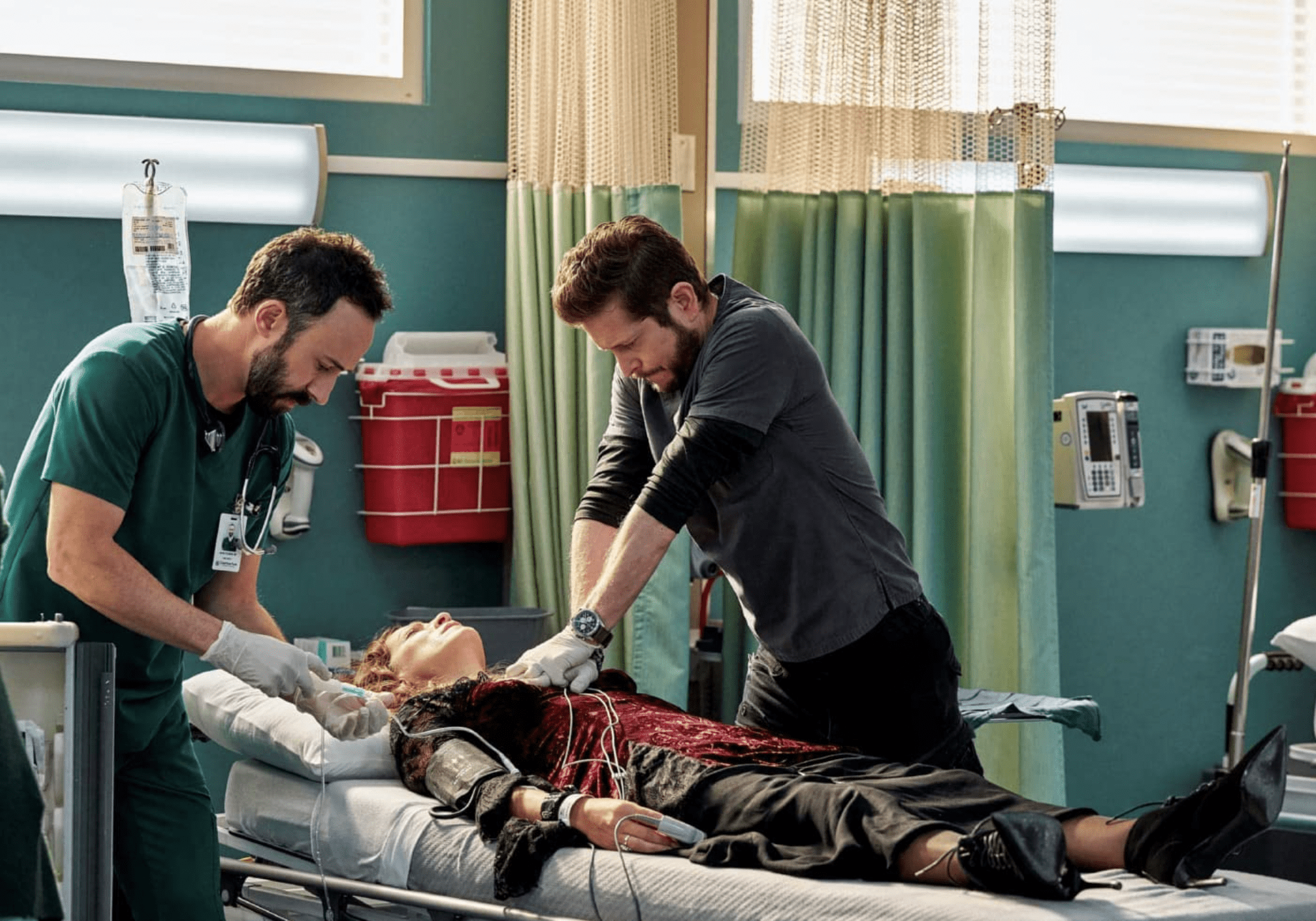 A male nurse and doctor try to save a patient in this image from Hulu