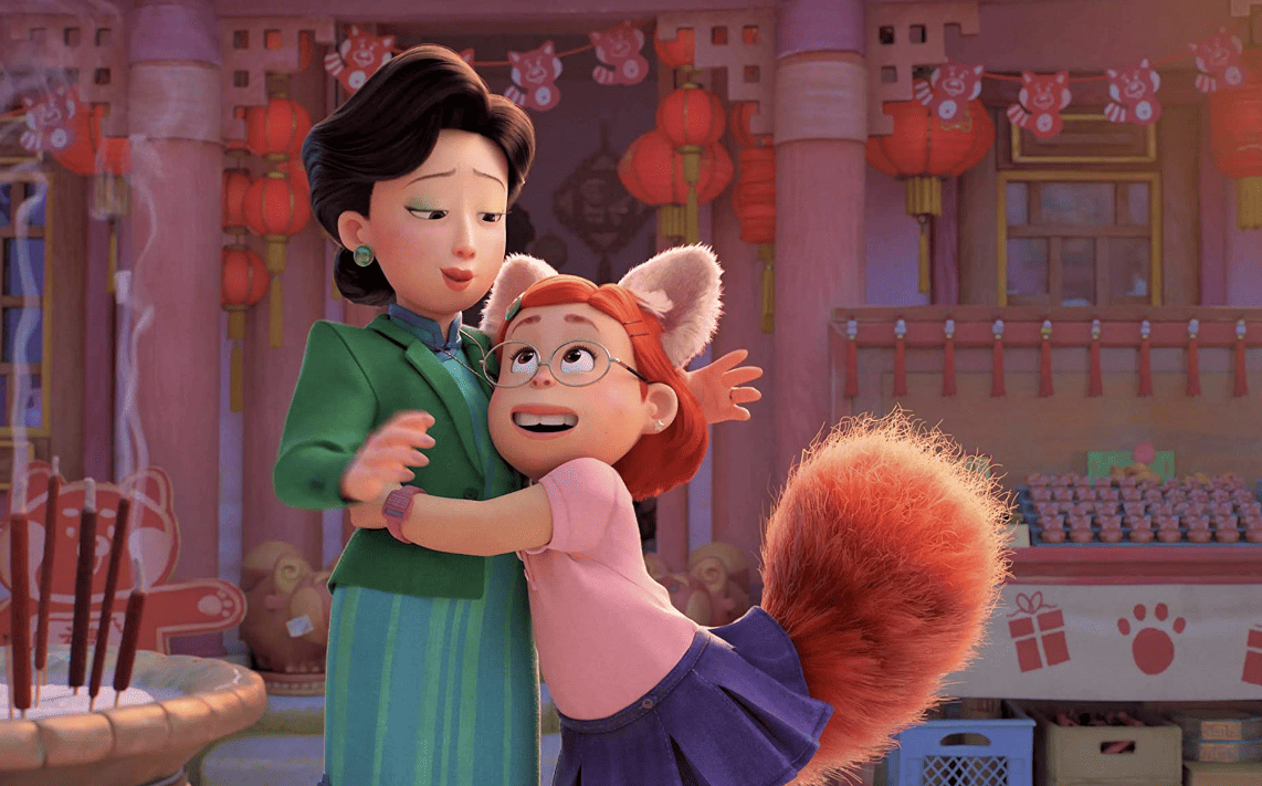 A mother and daughter, who has red panda ears and a tail, embrace in this image from Walt Disney Studio Motion Pictures.