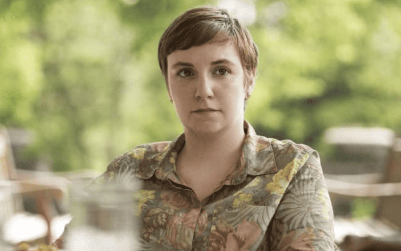 Hannah looks confident while rocking a very short hairstyle in this image from Apatow Productions