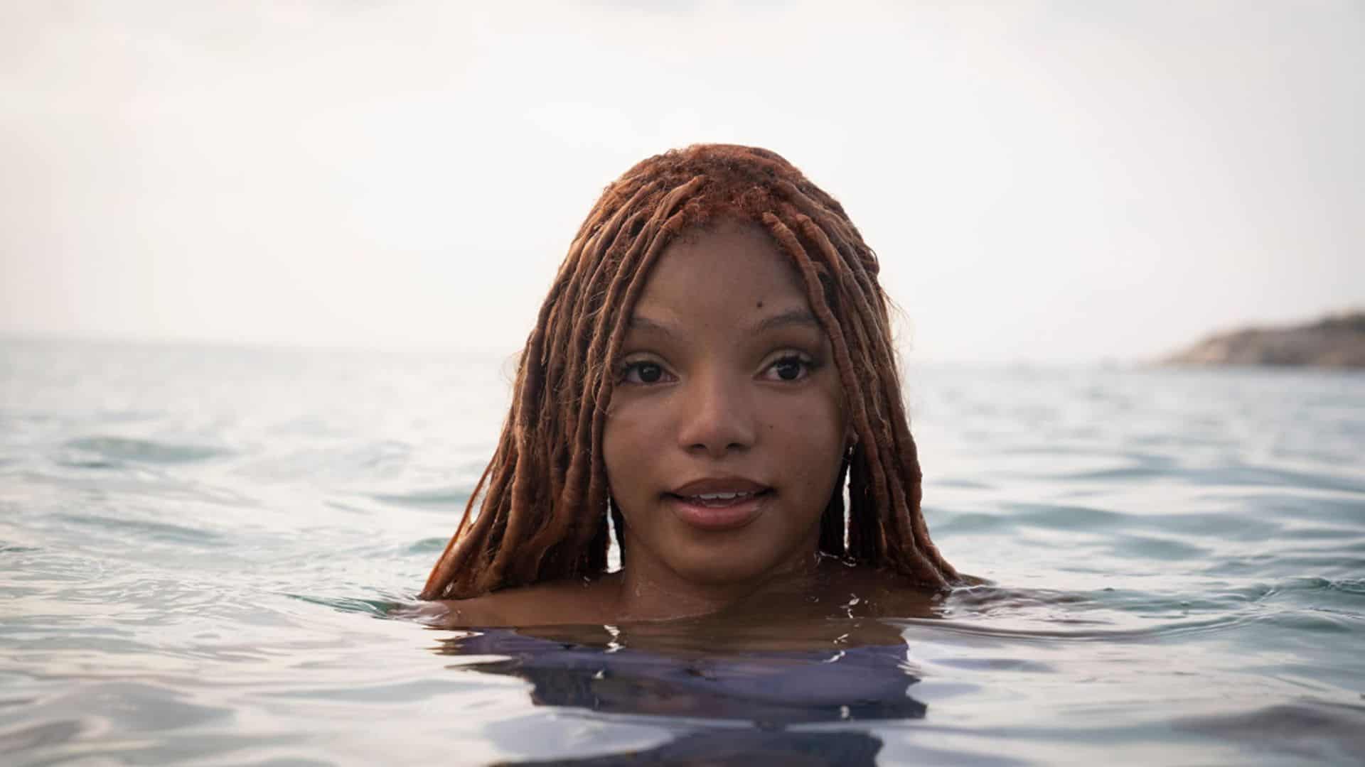 Halle Bailey looks above the ocean’s surface in this image from Walt Disney Pictures