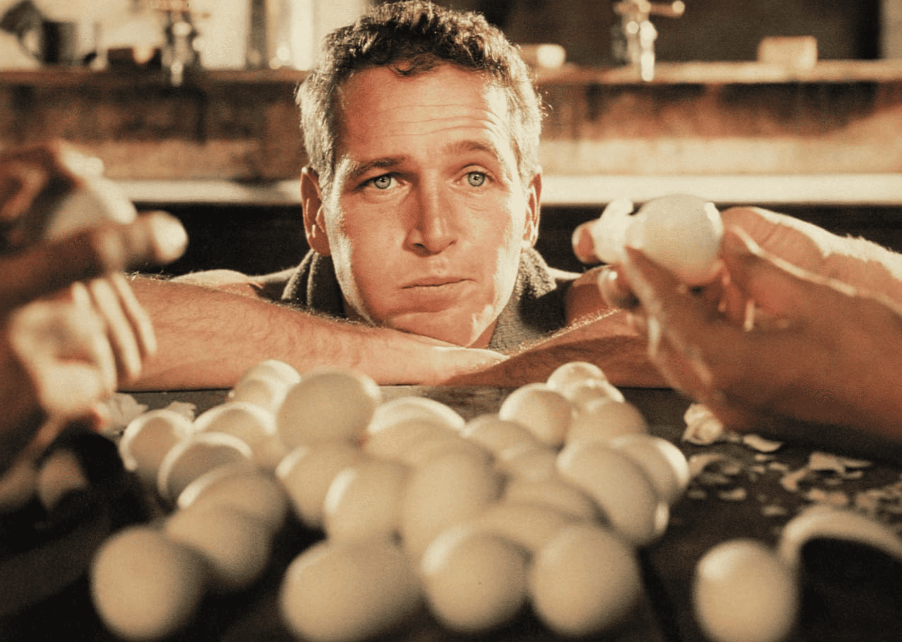 A man gazes at a pile of hard-boiled eggs in this image from Jalem Productions.