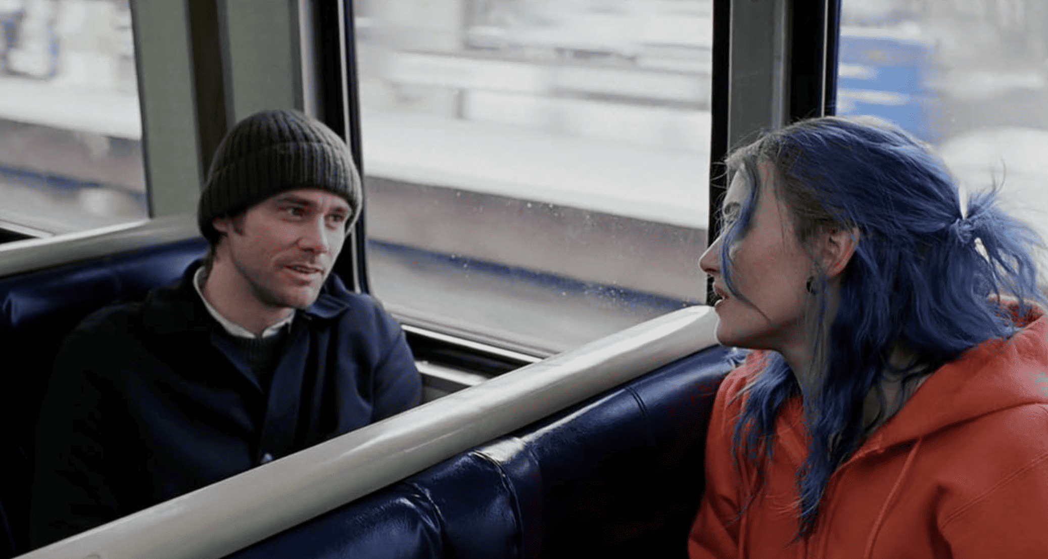 A man and a woman chat on the train in this image from Focus Features