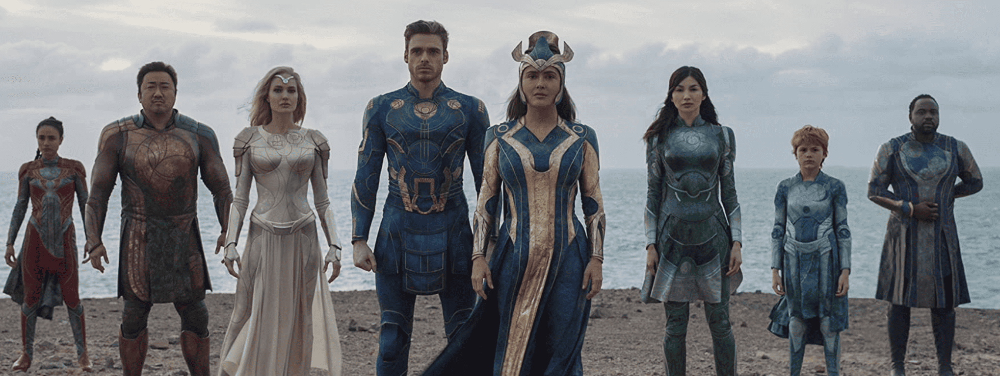 The Eternals standing on a cliff facing directly at the camera in this image from Marvel Studios