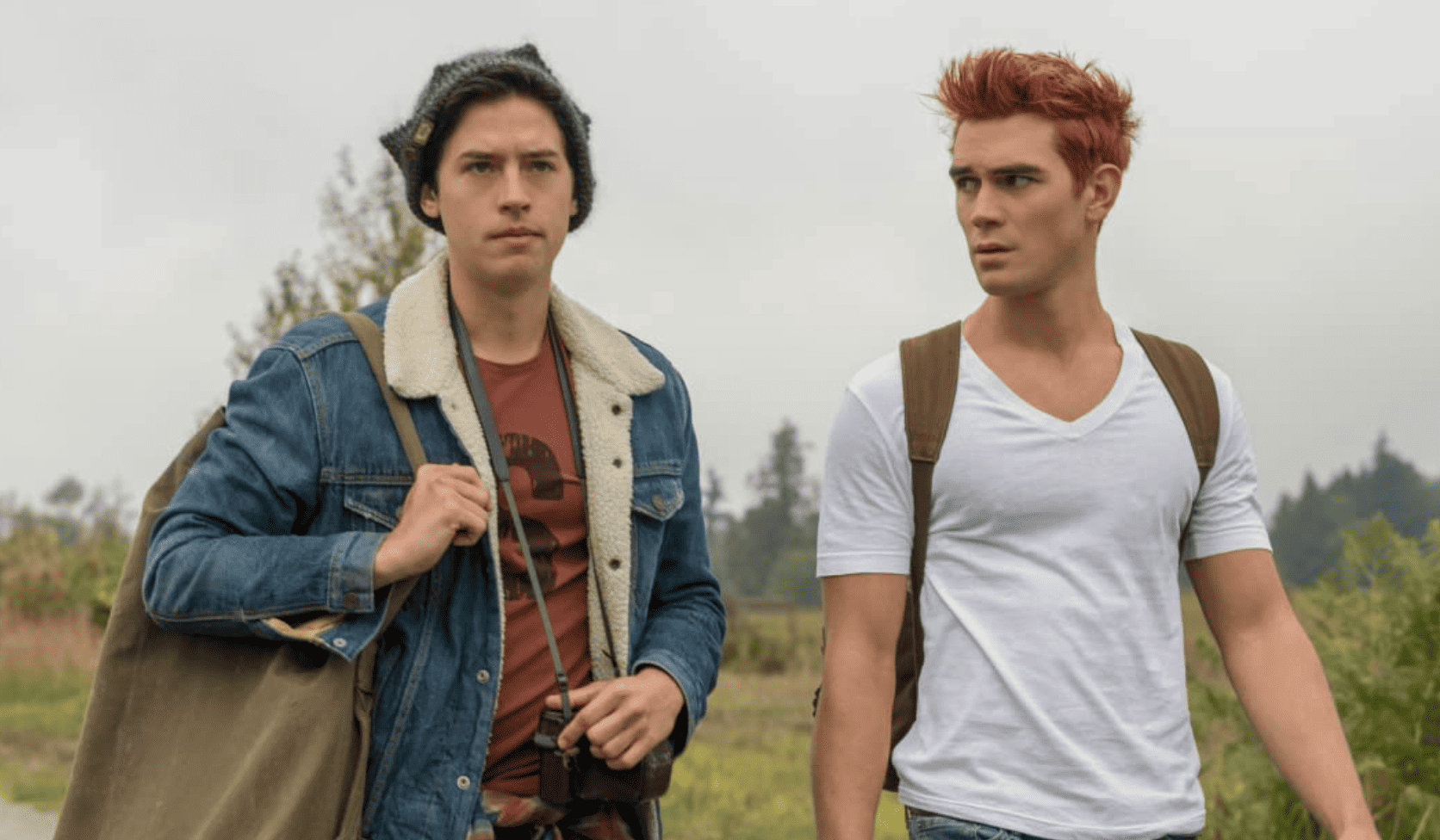 Jughead and Archie walking down a field in this image from CBS Studios.