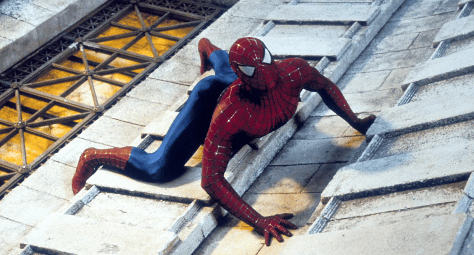Spider-Man crawling on the side of a building in this image from Columbia Pictures