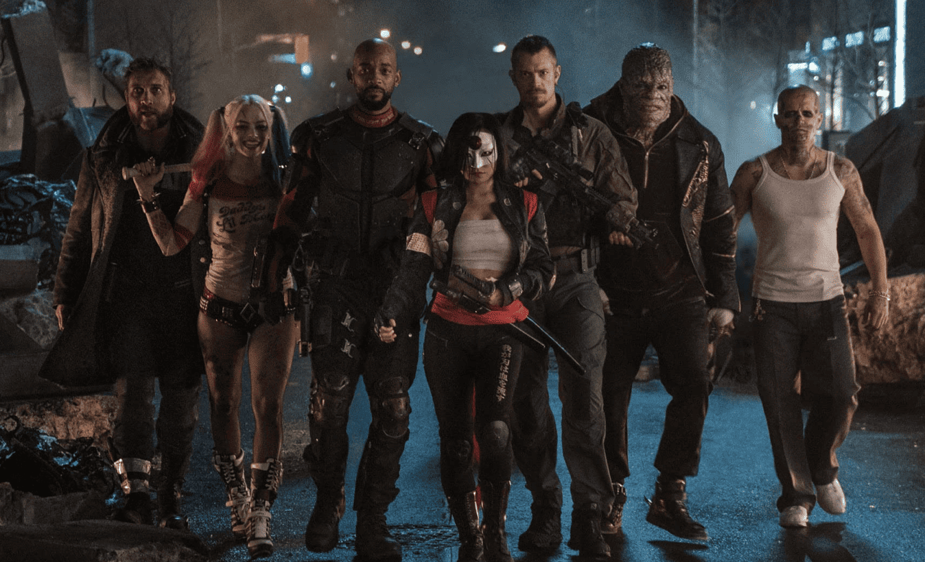 Harley Quinn (Margot Robbie) and the rest of the Suicide Squad walking down the street in this image from DC Entertainment