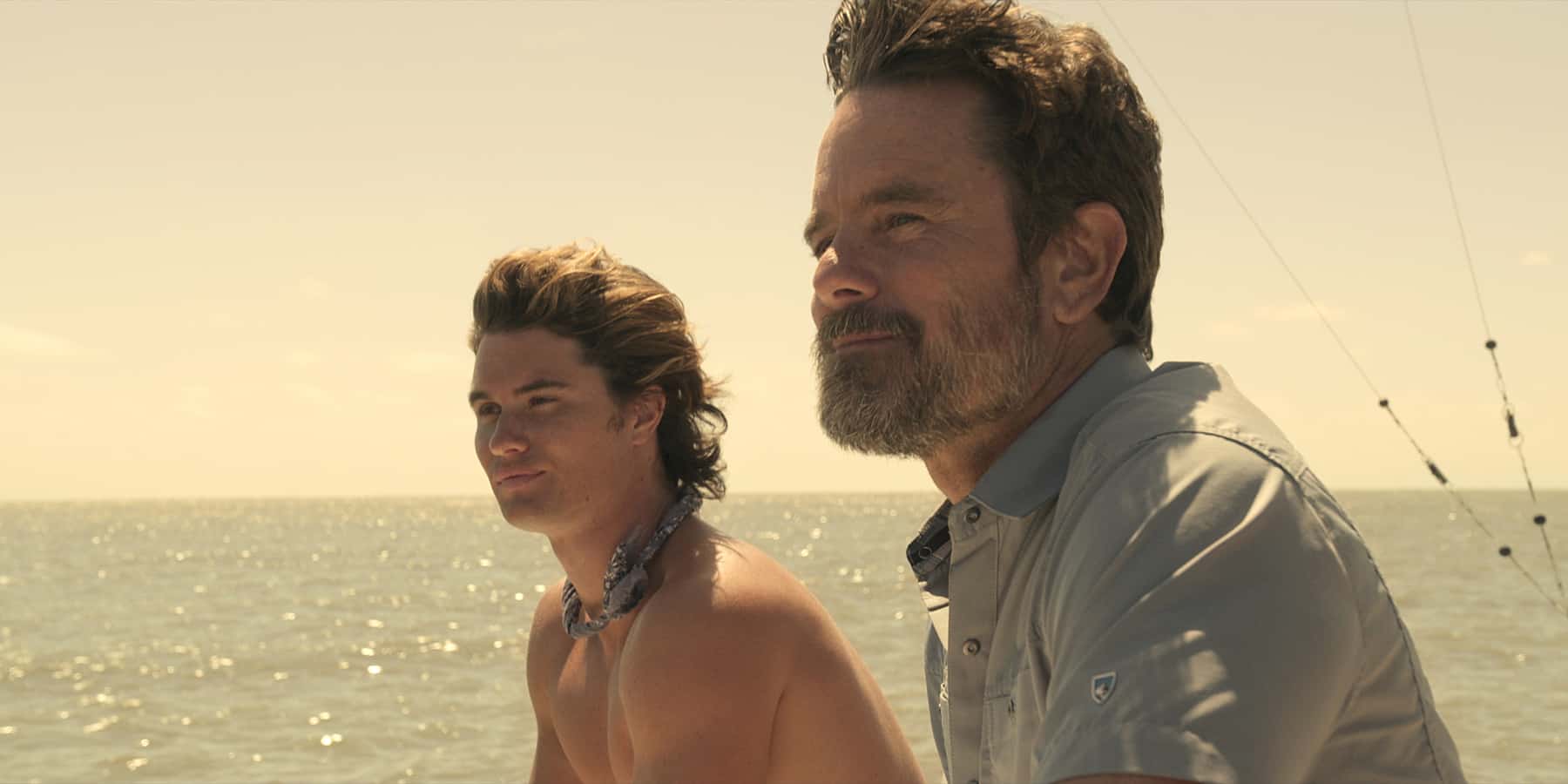 Chase Stokes and Charles Esten in this image from Red Canoe Productions