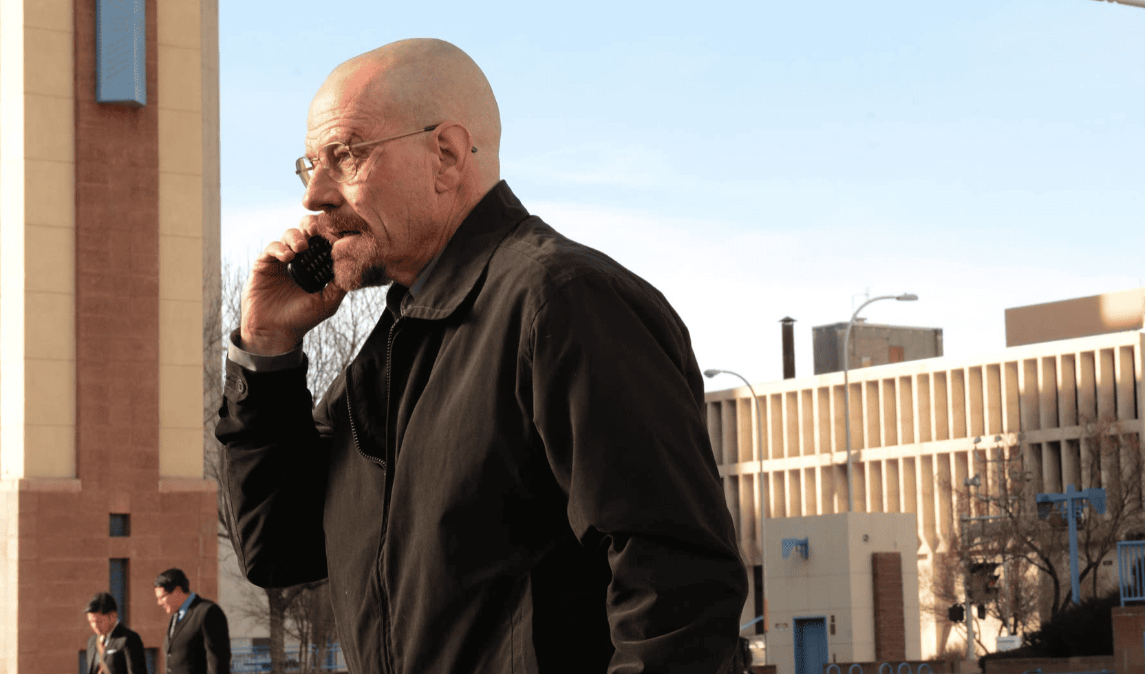 Walter White walking and talking on the phone in this image from High Bridge Entertainment.