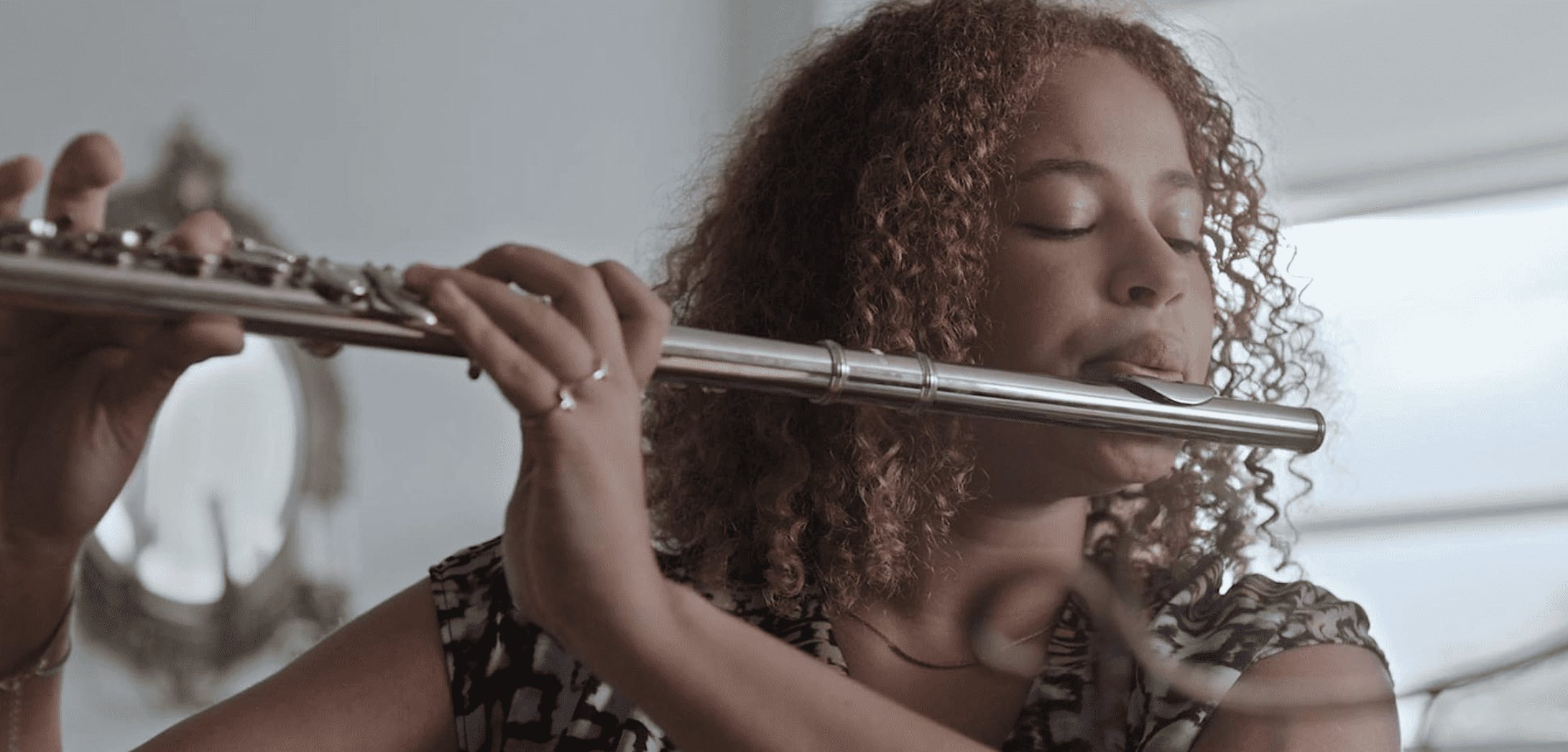 Caroline Watters playing the flute in this image from Apatow Productions