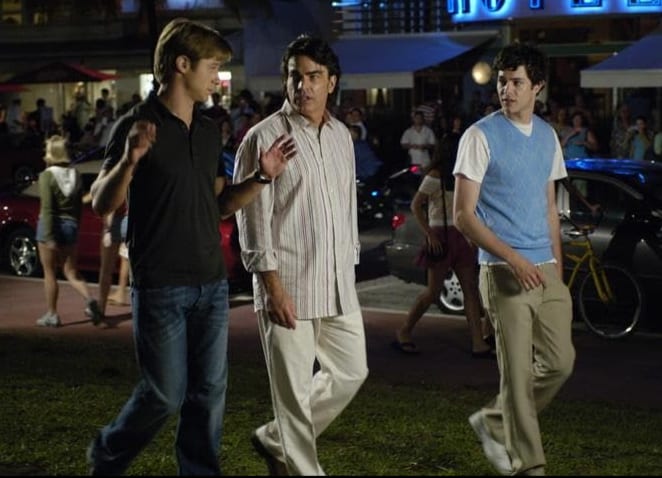Three men walk in this image from Warner Bros. Studios