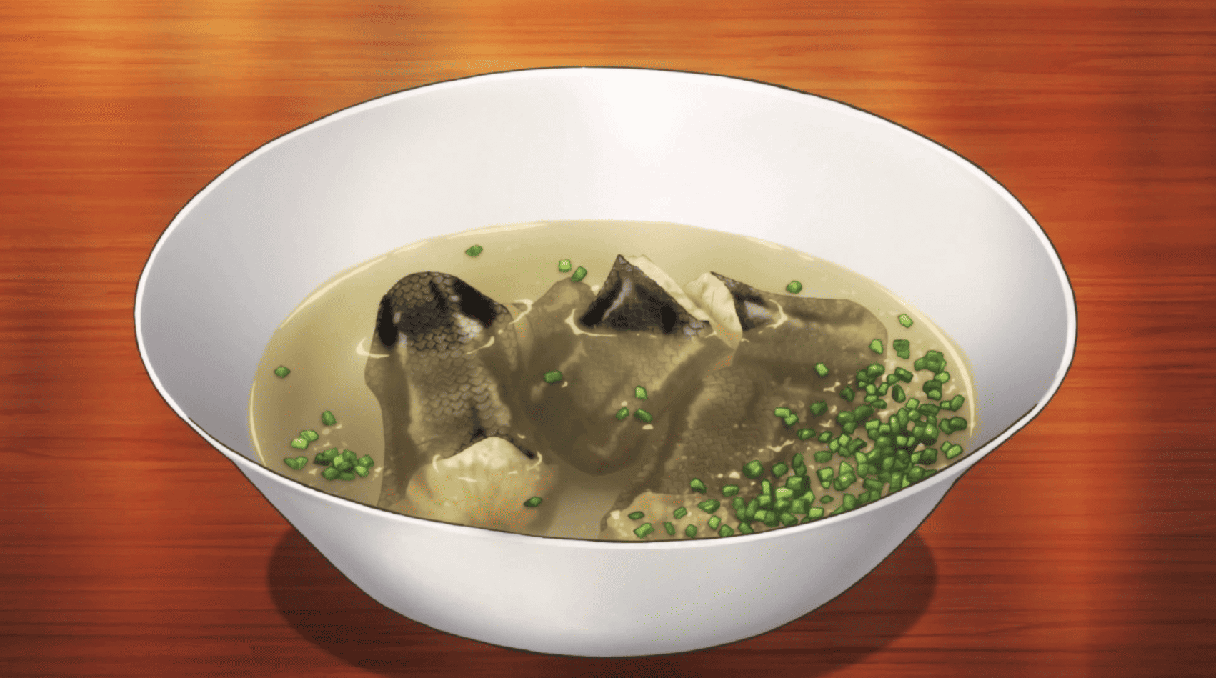 A bowl of boiled snake meat in a broth with green onions in this image from J.C. Staff