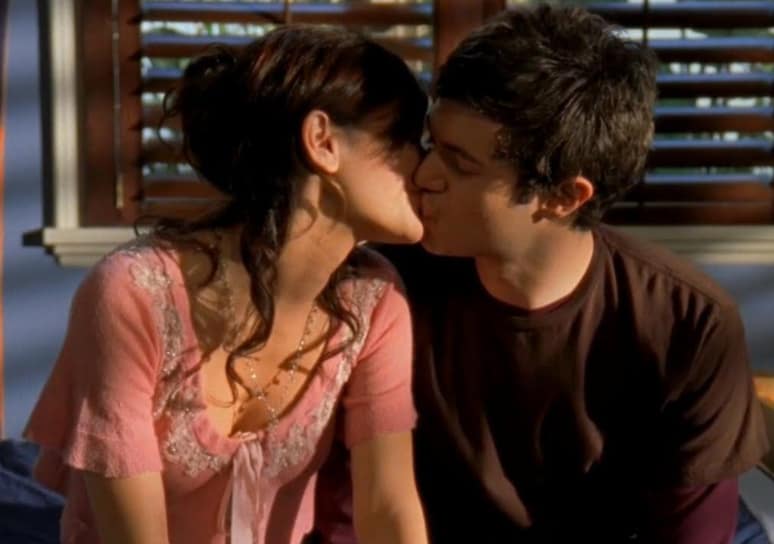 Two people kiss in this image from Warner Bros. Studios