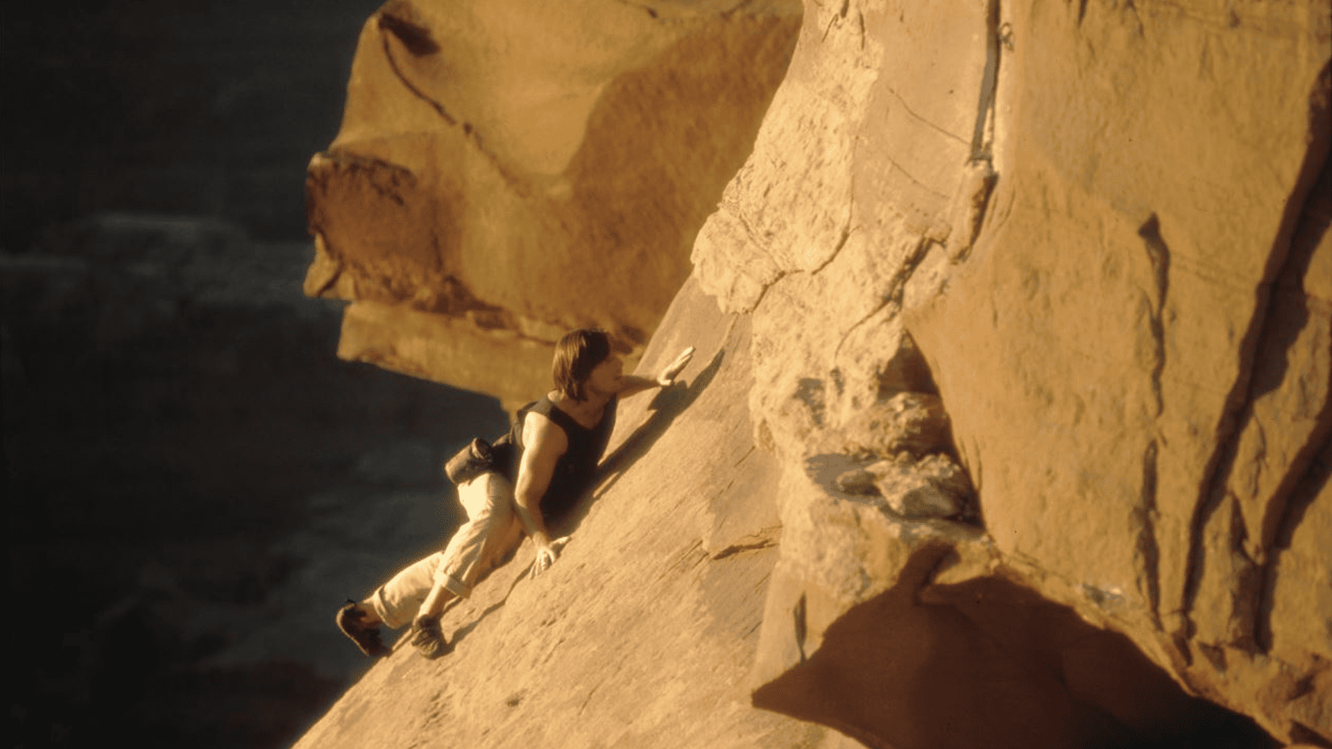 Tom Cruise climbs the dangerous cliffside of Dead Horse Point in this image from Paramount Pictures.