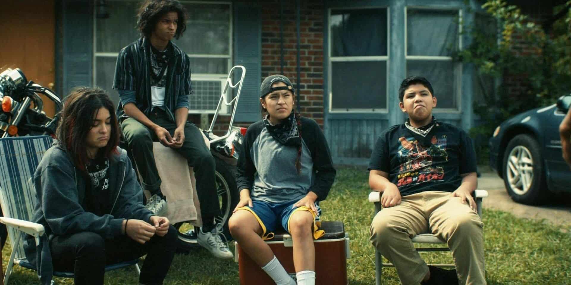 Devery Jacobs, D'Pharaoh Woon-A-Tai, Paulina Alexis, and Lane Factor sit in a front yard in this image from FXP