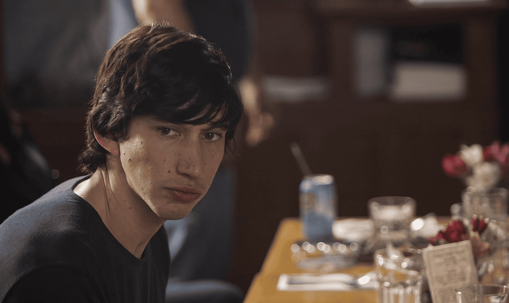 Adam Driver staring silently into the distance in this image from Apatow Productions