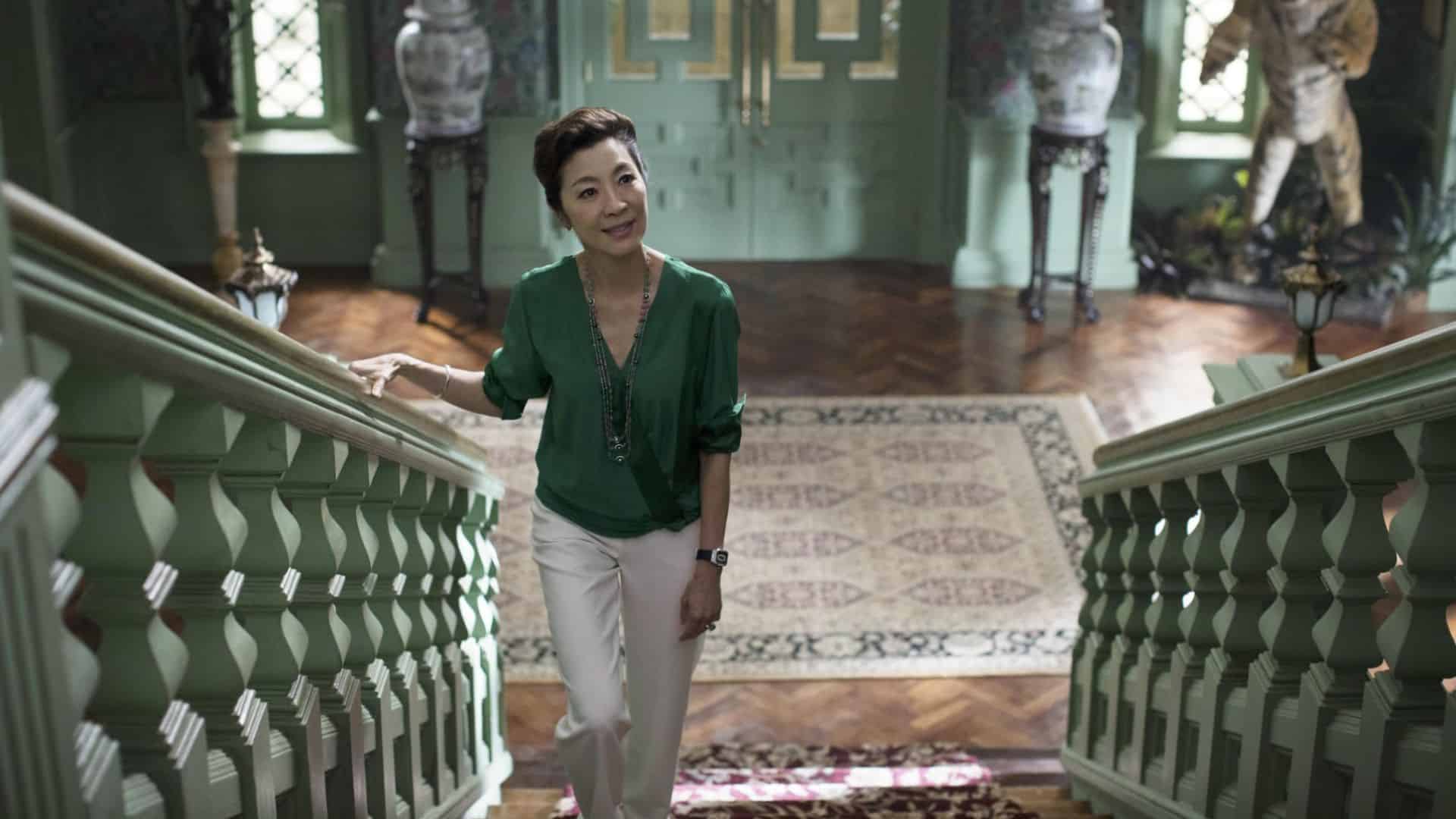 Michelle Yeoh walking up the stairs of a mansion in this image from Ivanhoe Pictures.