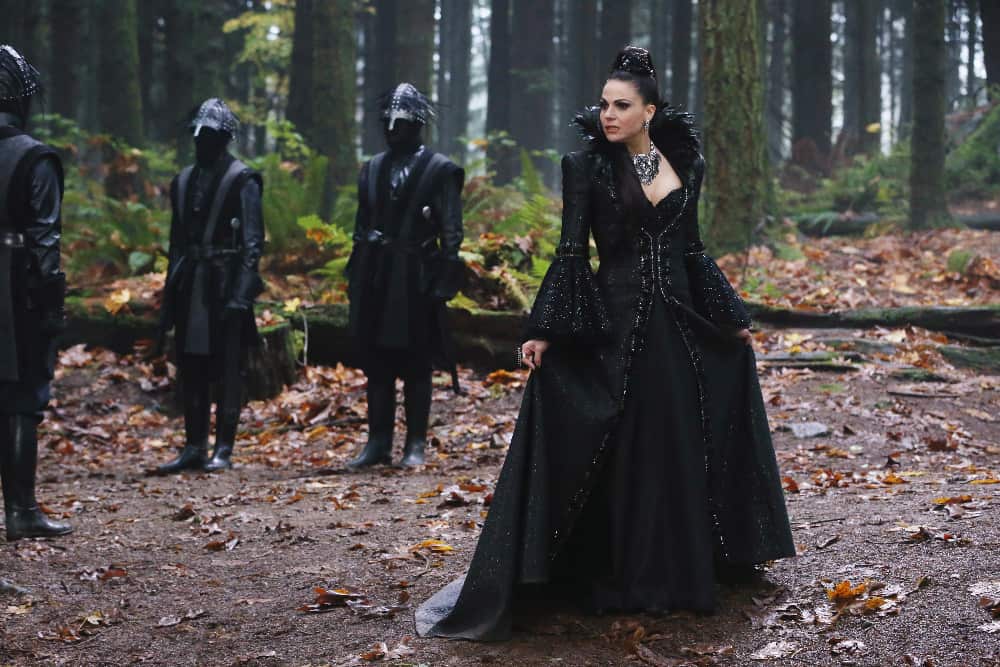 The Evil Queen with her guards in the forest in this image from ABC Studios