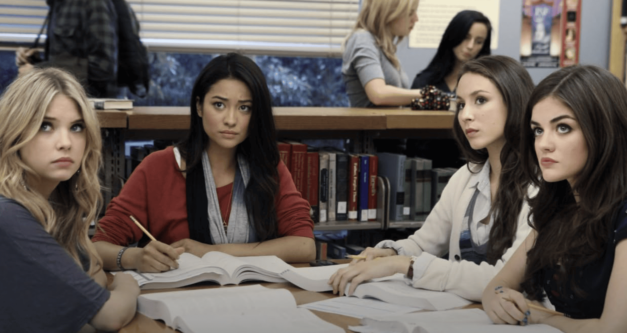 Four girls in the school library in this image from Warner Horizon Television