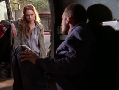 A woman talks to a man in a van in this image from Warner Bros. Studios