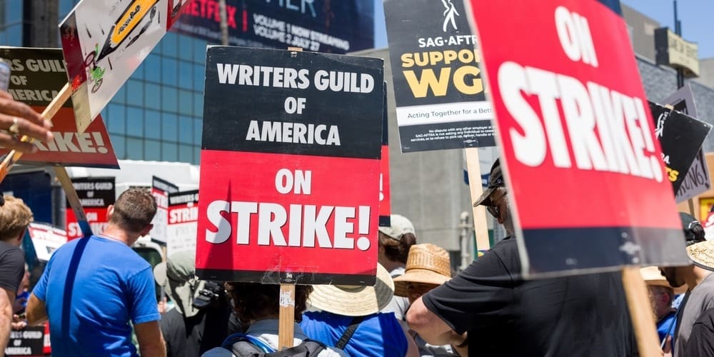 Picket signs by WGA and SAG-AFTRA in this image from Shutterstock