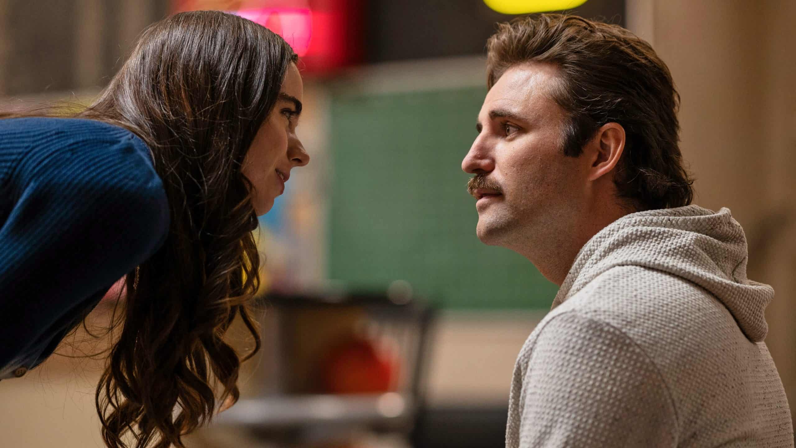 A teenage girl leans down to speak to a man with a mustache in this image from Showtime.