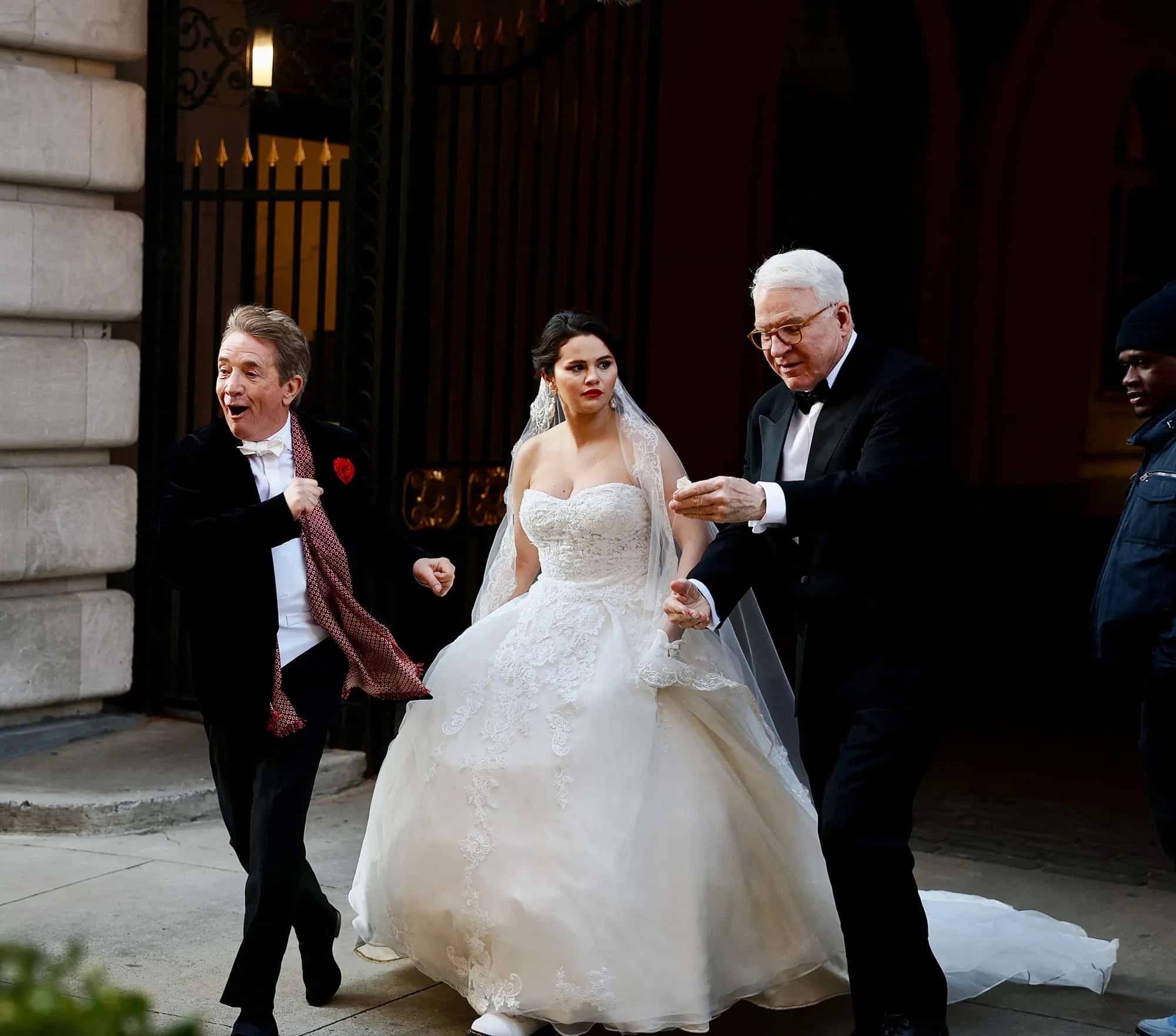 Mabel in a wedding gown accompanied by Oliver and Charles in tuxedos in this image from 20th Century Fox Television