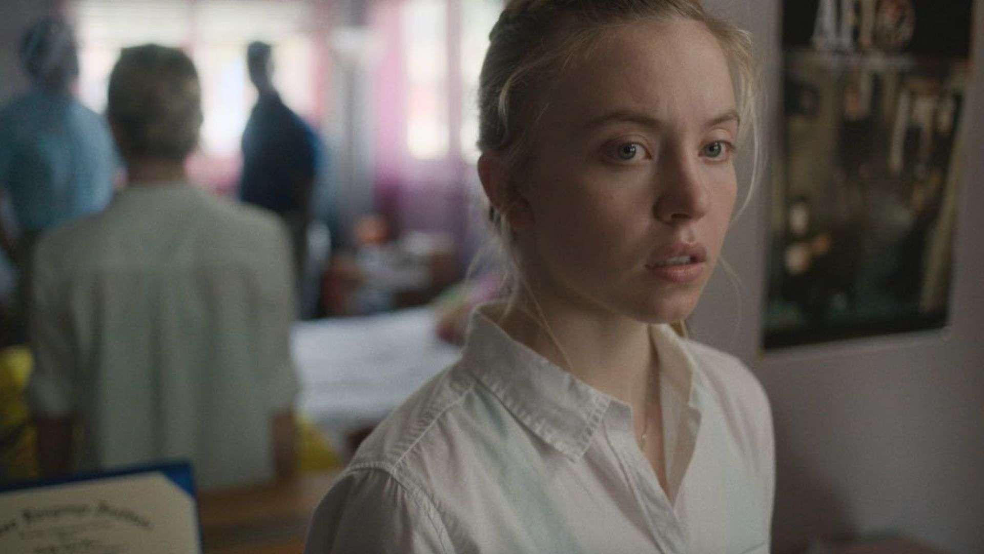 Sydney Sweeney in a white collared shirt in this image from Apple TV Plus.