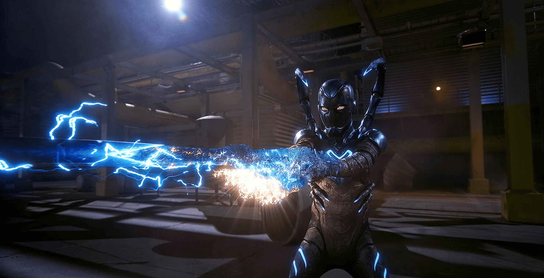 A suited-up man conjures an electrifying blue sword. (Image: DC Studios)