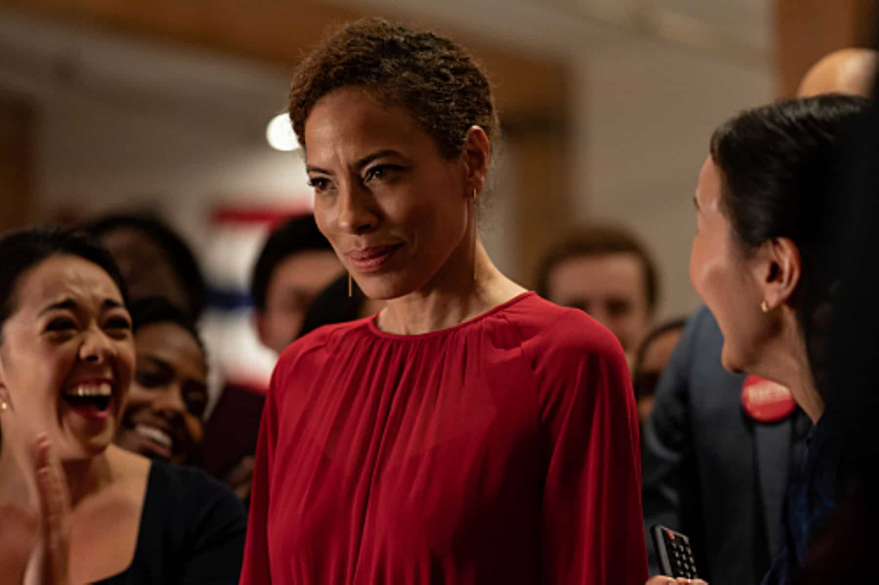 A woman looks ahead menacingly as she stands in a crowd in this photo from Showtime