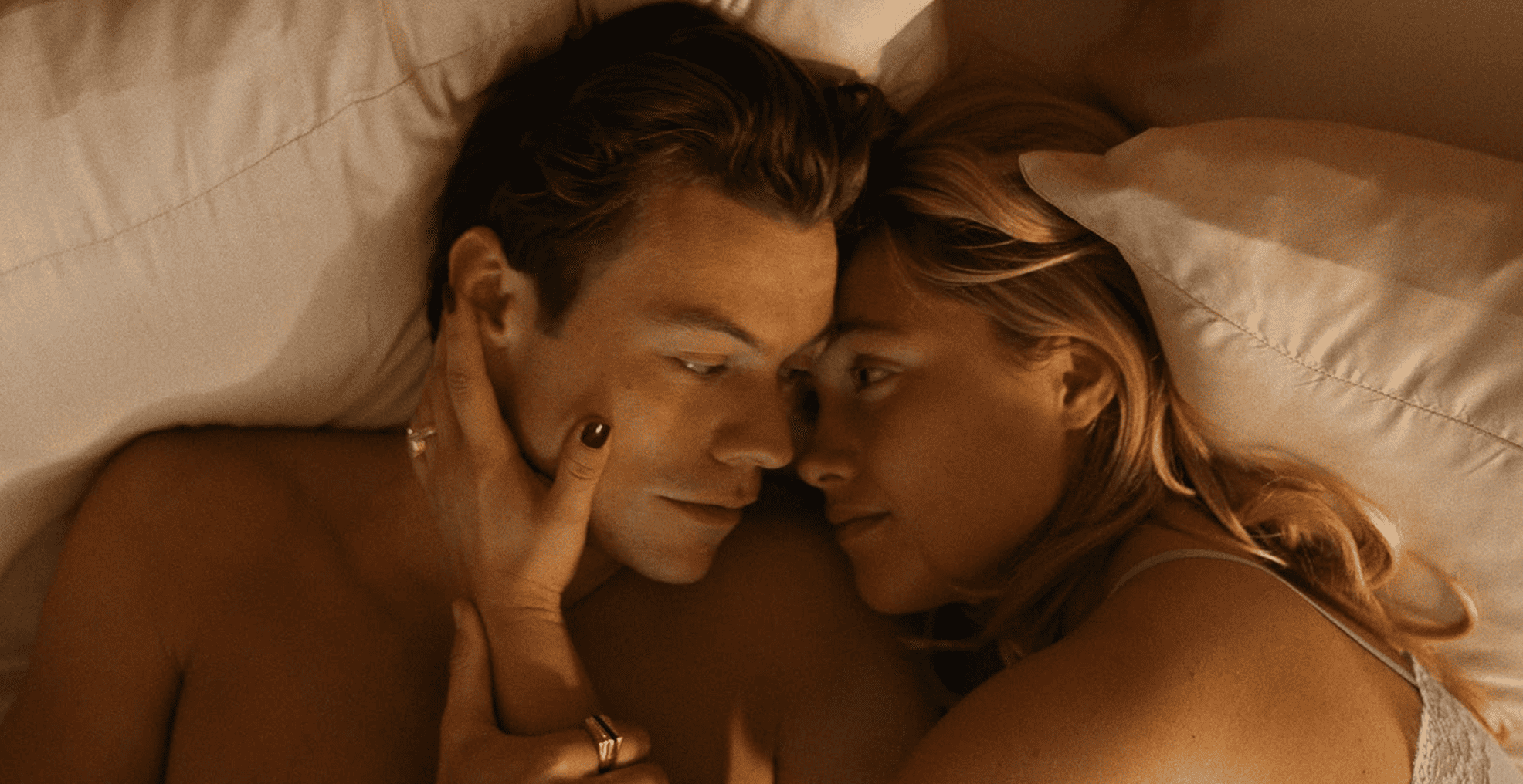 A couple lay in bed together in this image from New Line Cinema.