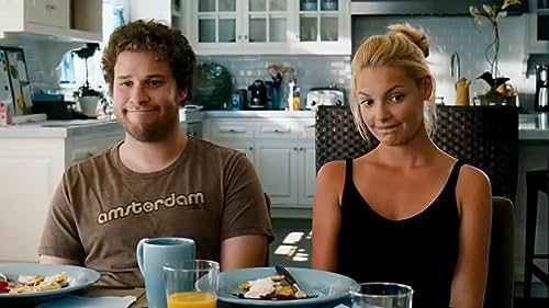 A couple sits together at a breakfast table in this image from Apatow Productions.