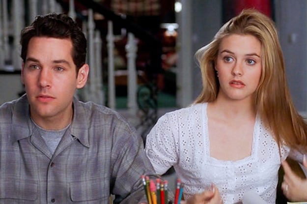 A teen boy and girl sit beside each other at a dinner table in this image from Paramount Pictures.