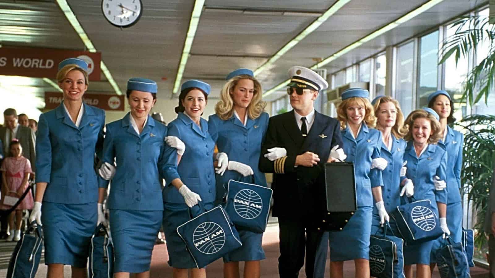 Pan Am stewardesses walk arm-in-arm with a pilot in this image from DreamWorks Pictures.
